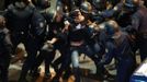 A demonstrator struggles with Spanish National Police riot officers outside the the Spanish parliament in Madrid September 25, 2012. Protesters clashed with police in Spain's capital on Tuesday as the government prepares a new round of unpopular austerity measures for the 2013 budget that will be announced on Thursday. REUTERS/Sergio Perez (SPAIN - Tags: CIVIL UNREST POLITICS BUSINESS TPX IMAGES OF THE DAY) Published: Zář. 25, 2012, 6:50 odp.