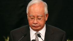 Malaysia's Prime Minister Najib Razak makes an announcement on the latest development on the missing Malaysia Airlines MH370 plane at Putra World Trade Center in Kuala Lumpur