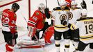 Boston Bruins' Chris Kelly (C) celebrates his goal with teammates Daniel Paille and Tyler Seguin (R) on Chicago Blackhawks goalie Corey Crawford (2nd L) and Michal Rozsiv