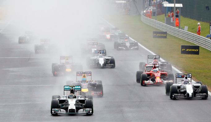 Mercedes Formula One driver Nico Rosberg of Germany drives followed by Red Bull Formula One driver Sebastian Vettel of Germany, Ferrari Formula One driver Fernando Alonso