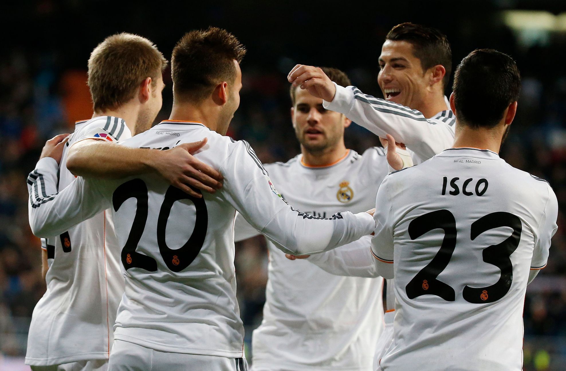 Real Madrid's Jese Rodriguez celebrates scoring against Espanyol with his teammates during their Spanish King's Cup match at Santiago Bernabeu stadium in Madrid