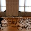 Member of staff makes last touches to  installation 'Forge' by Chinese artist Ai Weiwei at the Martin-Gropius Bau, in Berlin
