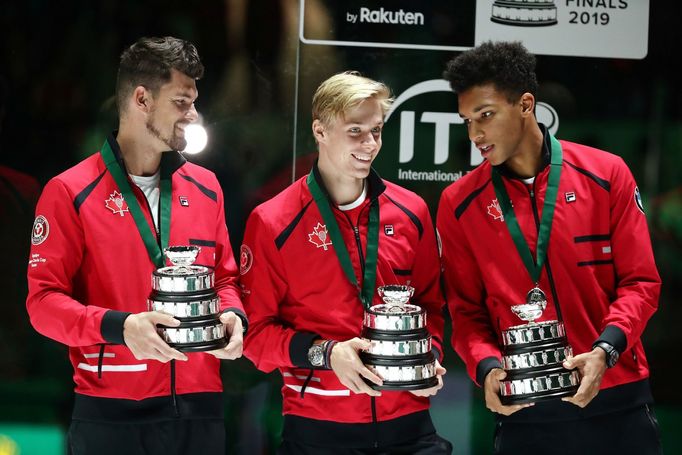 Tennis - Davis Cup Finals - Final - Caja Magica, Madrid, Spain - November 24, 2019   Canada's Felix Auger-Aliassime, Denis Shapovalov and captain Frank Dancevic after los