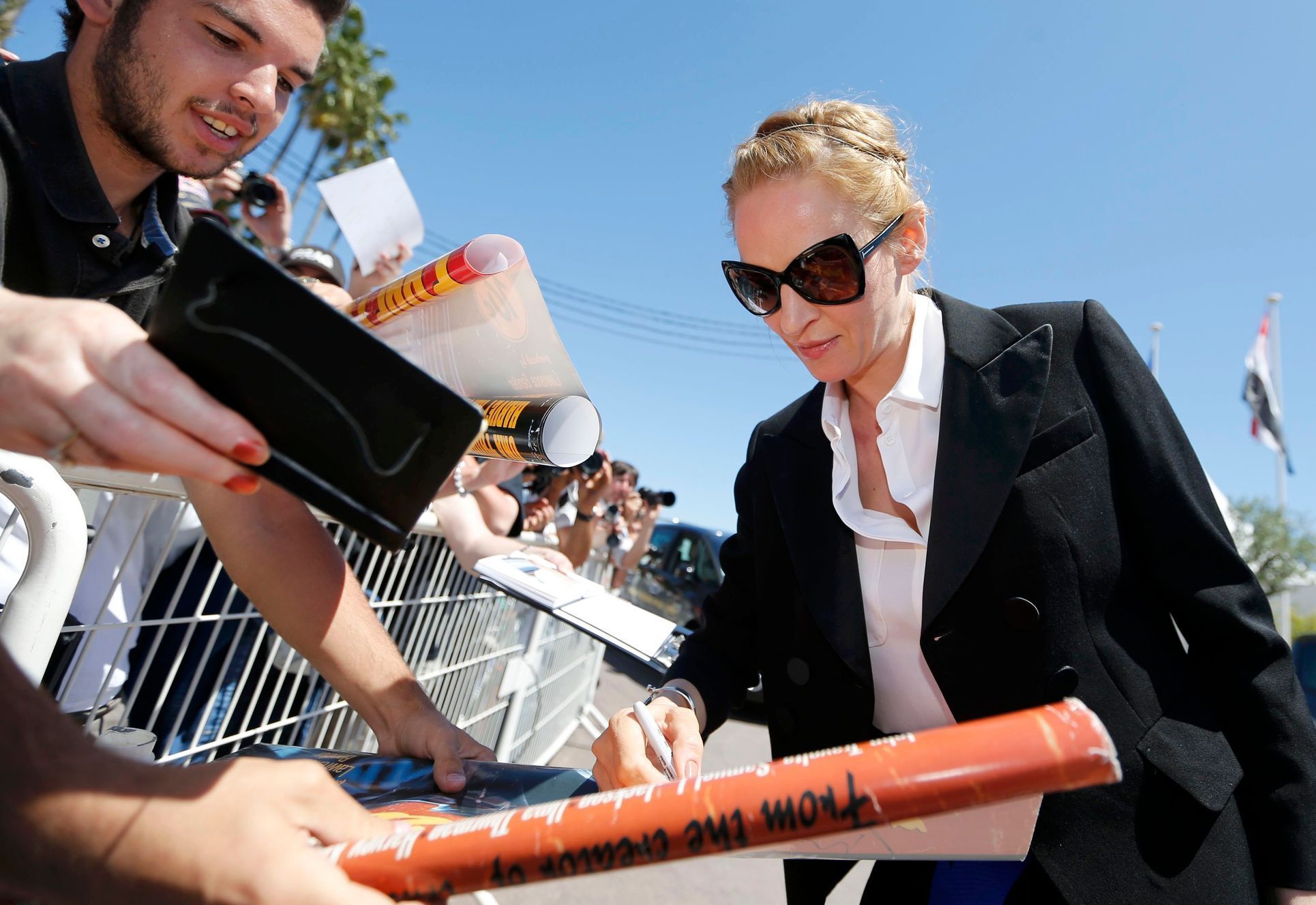 Actress Uma Thurman signs autographs to cinema fans on the Croisette during the 67th Cannes Film Festival in Cannes