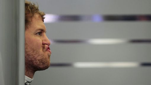 Red Bull Formula One driver Sebastian Vettel of Germany reacts during the first practice session of the Bahrain F1 Grand Prix at the Bahrain International Circuit (BIC) i