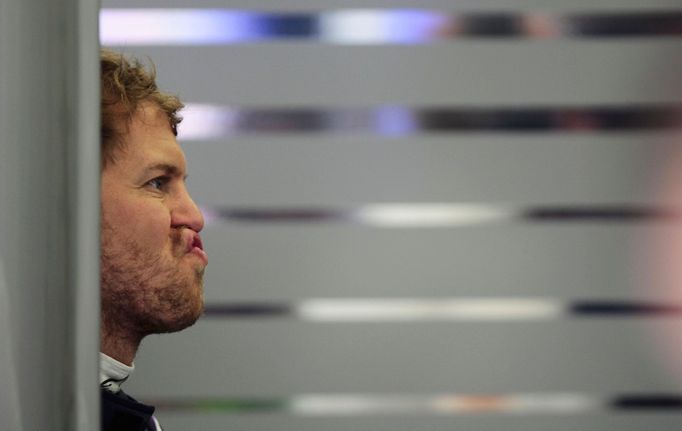 Red Bull Formula One driver Sebastian Vettel of Germany reacts during the first practice session of the Bahrain F1 Grand Prix at the Bahrain International Circuit (BIC) i