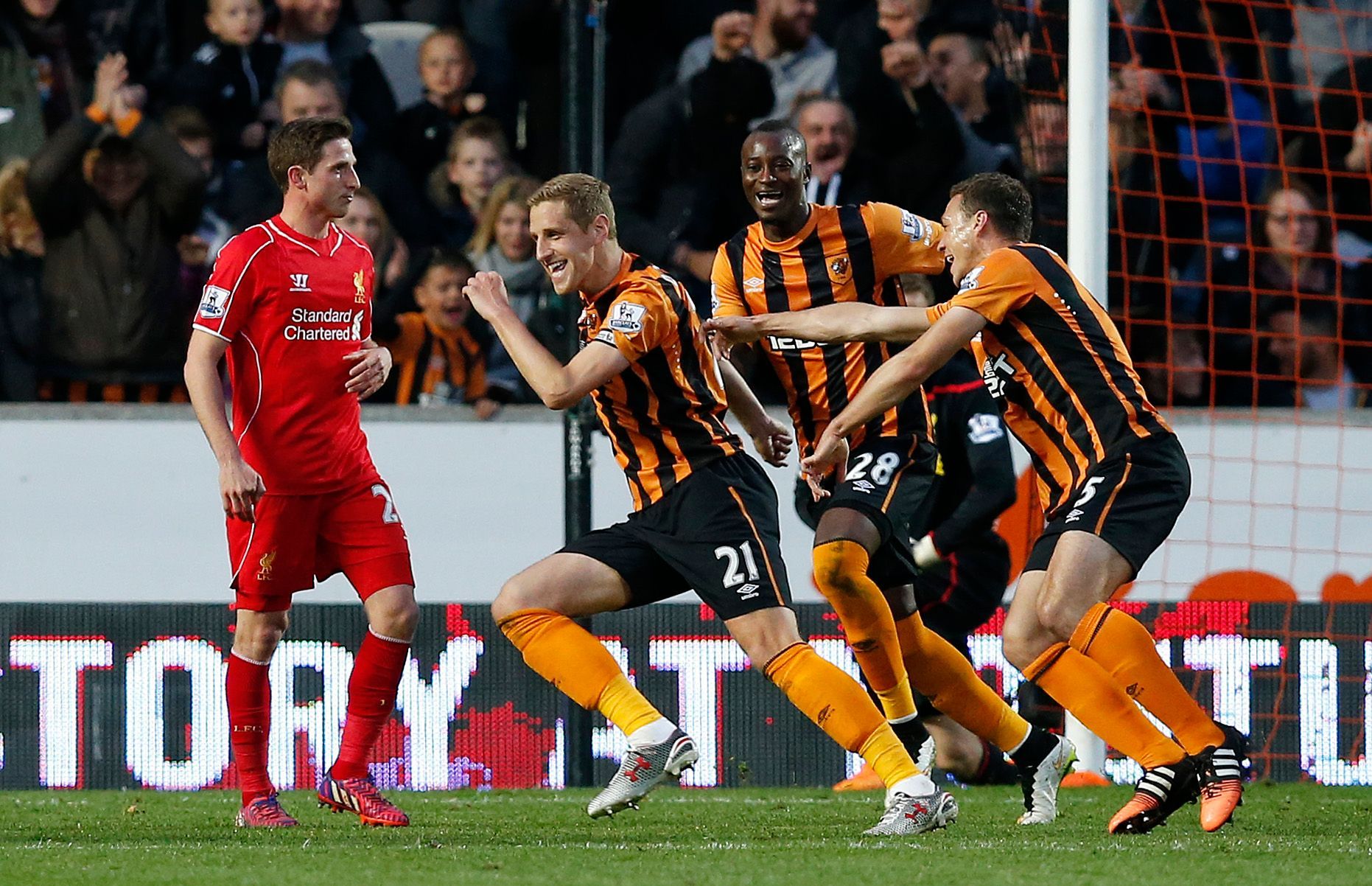 Football: Michael Dawson celebrates with team mates after scoring the first goal for Hull