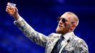 FILE PHOTO: UFC lightweight champion Conor McGregor of Ireland raises a cup of Irish whiskey during post-fight news conference at T-Mobile Arena in Las Vegas, Nevada, U.S