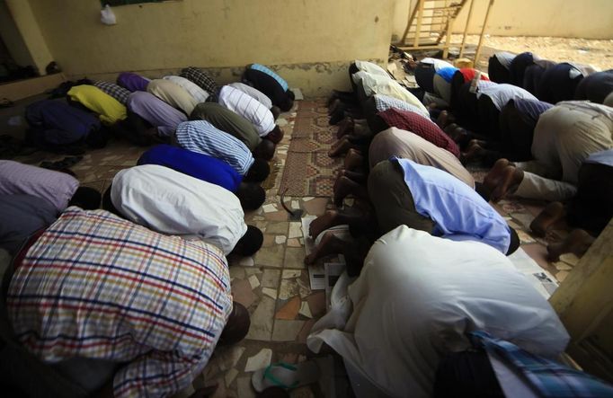 Muslims pray during Friday prayers outside Juba mosque in Juba