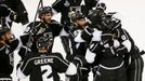 Los Angeles Kings' Justin Williams (14) is congratulated by teammates after scoring the winning goal on the New York Rangers in overtime in Game 1 of their NHL Stanley Cu