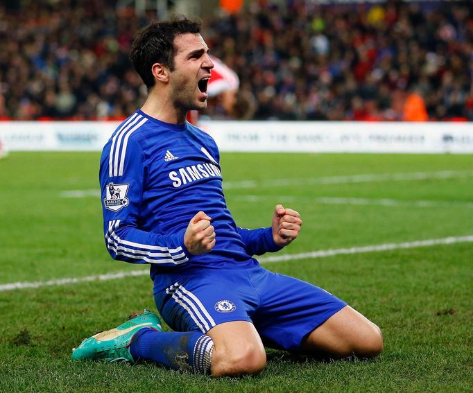 Chelsea's Cesc Fabregas celebrates after scoring the second goal during their English Premier League soccer match against Stoke City at the Britannia Stadium in Stoke-on-