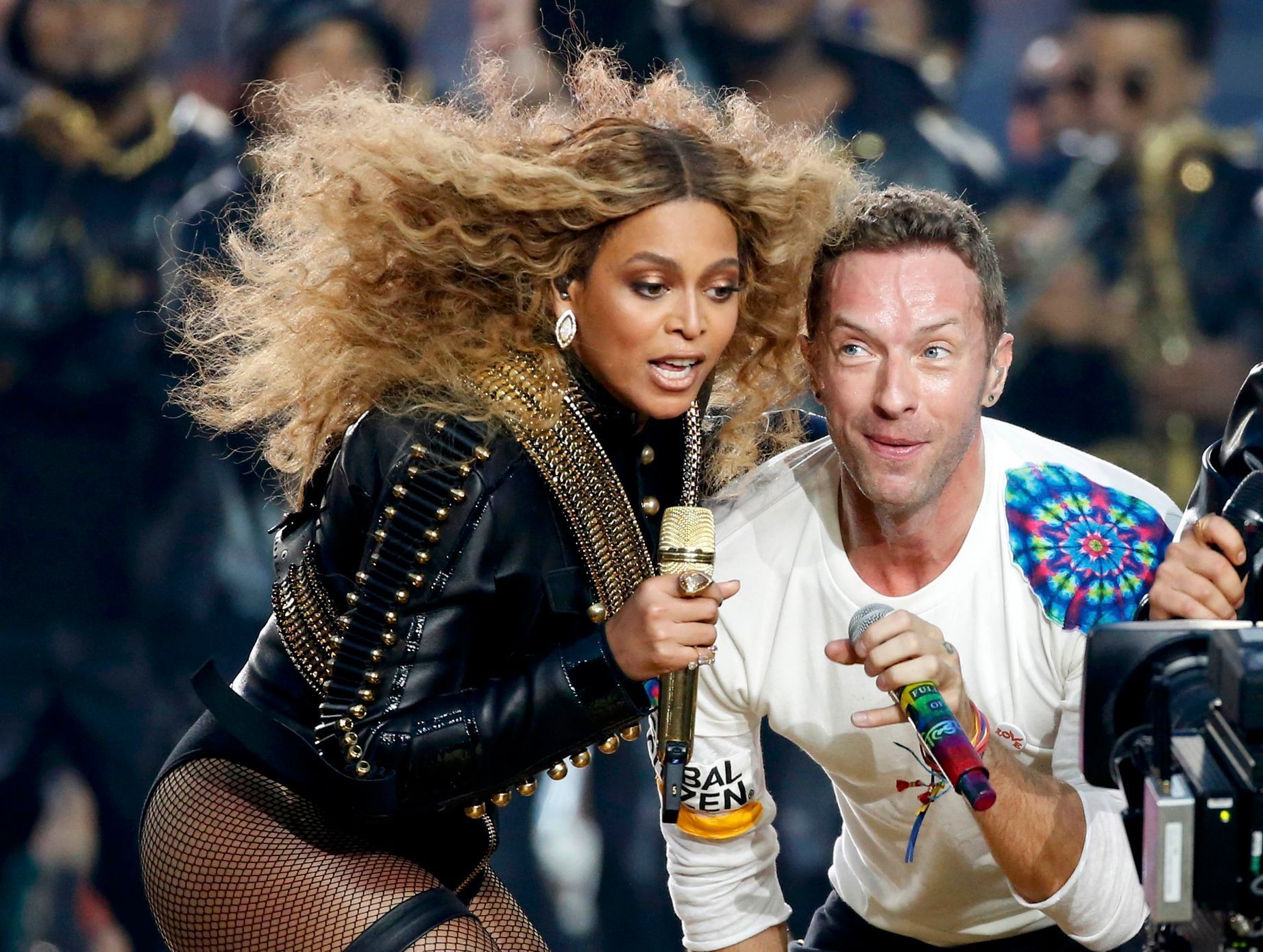 Beyonce and Chris Martin of Coldplay perform during the half-time show at the NFL's Super Bowl 50 between the Carolina Panthers and the Denver Broncos in Santa Clara
