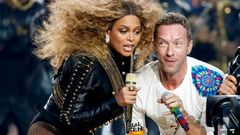 Beyonce and Chris Martin of Coldplay perform during the half-time show at the NFL's Super Bowl 50 between the Carolina Panthers and the Denver Broncos in Santa Clara
