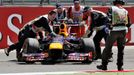 Marshalls remove the abandoned car of Red Bull Formula One driver Sebastian Vettel of Germany during the British Grand Prix at the Silverstone Race circuit, central Engla