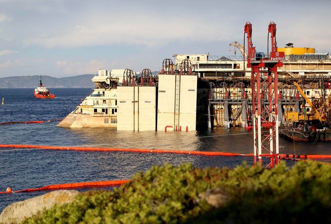 The rear of the cruise liner Costa Concordia is seen at Giglio harbour at Giglio Island July 18, 2014.