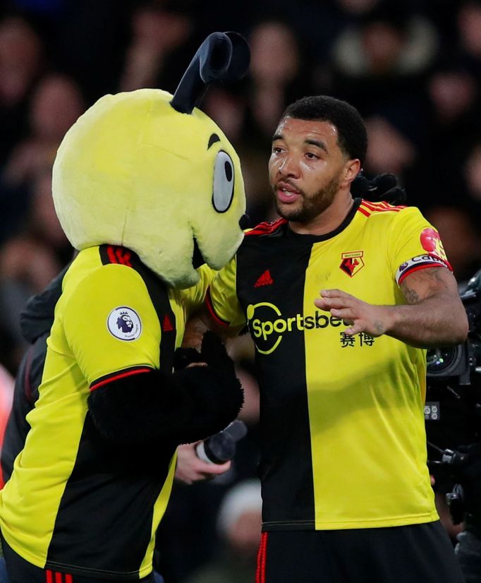 Soccer Football - Premier League - Watford v Liverpool - Vicarage Road, Watford, Britain - February 29, 2020  Watford's Troy Deeney celebrates with mascot Harry the Horne