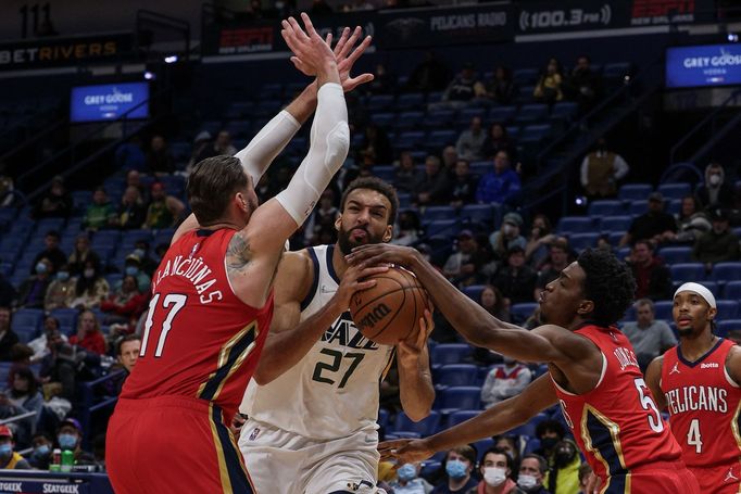 Jan 3, 2022; New Orleans, Louisiana, USA;  Utah Jazz center Rudy Gobert (27) has the ball knocked loose by New Orleans Pelicans forward Herbert Jones (5) during the secon