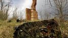 Brick chimney stands as the sole remainder of a house destroyed by fire in the abandoned village of Kazhushki