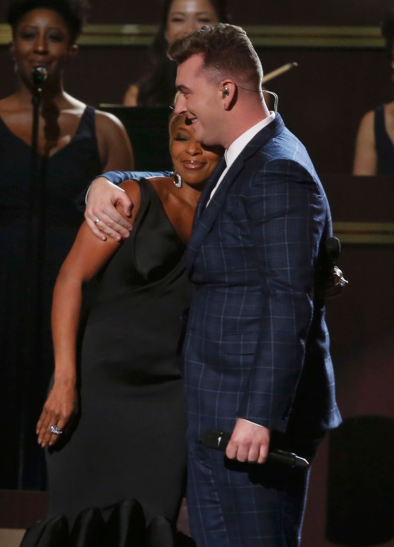Sam Smith embraces Mary J. Blige after they performed &quot;Stay With Me&quot; at the 57th annual Grammy Awards in Los Angeles