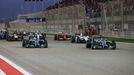 Mercedes Formula One driver Nico Rosberg of Germany (R) leads the pack at the start of the Bahrain F1 Grand Prix at the Bahrain International Circuit (BIC) in Sakhir, sou