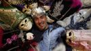 Marco Dilauro poses with his creations, which were used in previous Venice Carnivals January 25, 2013. Dilauro, 43, is a tax collector by day, but his real passion is making masks and costumes for the carnival. A resident of Como, northern Italy, he chooses fabrics, ribbons, lace and costume jewellery to make the period costumes after doing extensive research, and wears them at Carnival, which ends on the day before Ash Wednesday. Picture taken January 25, 2013. REUTERS/Alessandro Bianchi (ITALY - Tags: SOCIETY PORTRAIT) Published: Led. 27, 2013, 11:58 odp.