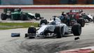 Williams Formula One driver Valtteri Bottas of Finland drives past debris during the Malaysian F1 Grand Prix at Sepang International Circuit outside Kuala Lumpur, March 3