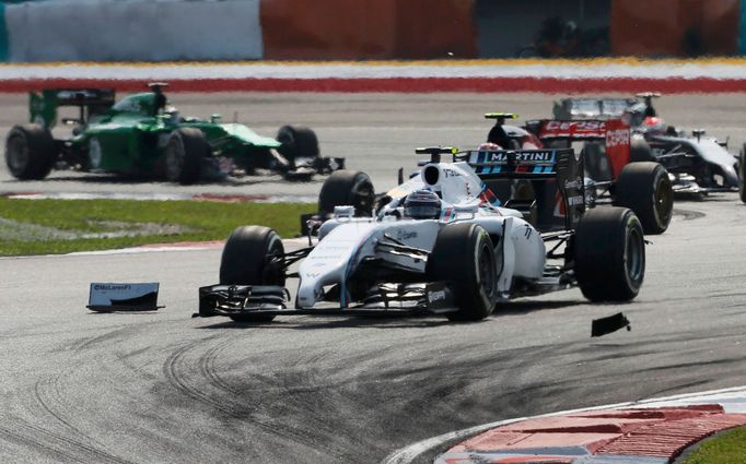 Williams Formula One driver Valtteri Bottas of Finland drives past debris during the Malaysian F1 Grand Prix at Sepang International Circuit outside Kuala Lumpur, March 3