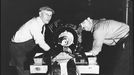 Detroit, Michigan. Assembly of Rolls Royce engines at the Packard motor car company. Final installation of the gear housing