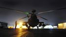 The Apache helicopter of Britain's Prince Harry is seen being prepared before a night mission from Camp Bastion, southern Afghanistan in this photograph taken December 11, 2012, and released January 21, 2013. The Prince, who is serving as a pilot/gunner with 662 Squadron Army Air Corps, is on a posting to Afghanistan that runs from September 2012 to January 2013. Photograph taken December 11, 2012. REUTERS/John Stillwell/Pool (AFGHANISTAN - Tags: MILITARY POLITICS SOCIETY ROYALS CONFLICT) Published: Led. 21, 2013, 8:43 odp.