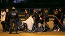 Police control crowds leaving the Stade de France where explosions were reported to have detonated outside the stadium during the France vs German friendly match near Par