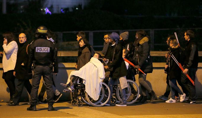 Police control crowds leaving the Stade de France soccer stadium where explosions were reported during the France vs German friendly match