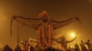 Naga sadhus, or Hindu holymen, arrive to attend the first 'Shahi Snan' (grand bath) at the ongoing "Kumbh Mela", or Pitcher Festival, in the northern Indian city of Allahabad January 14, 2013. During the festival, Hindus take part in a religious gathering on the banks of the river Ganges. "Kumbh Mela" will return again to Allahabad in 12 years. REUTERS/Jitendra Prakash (INDIA - Tags: RELIGION SOCIETY) Published: Led. 14, 2013, 7:39 dop.