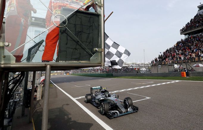 Mercedes driver Nico Rosberg of Germany crosses the checkered flag to win the Chinese Grand Prix.