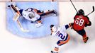 New York Islanders goalie Thomas Greiss (1) makes a save on a shot by Florida Panthers right wing Jaromir Jagr (68) as defenseman Nick Leddy (2) defend