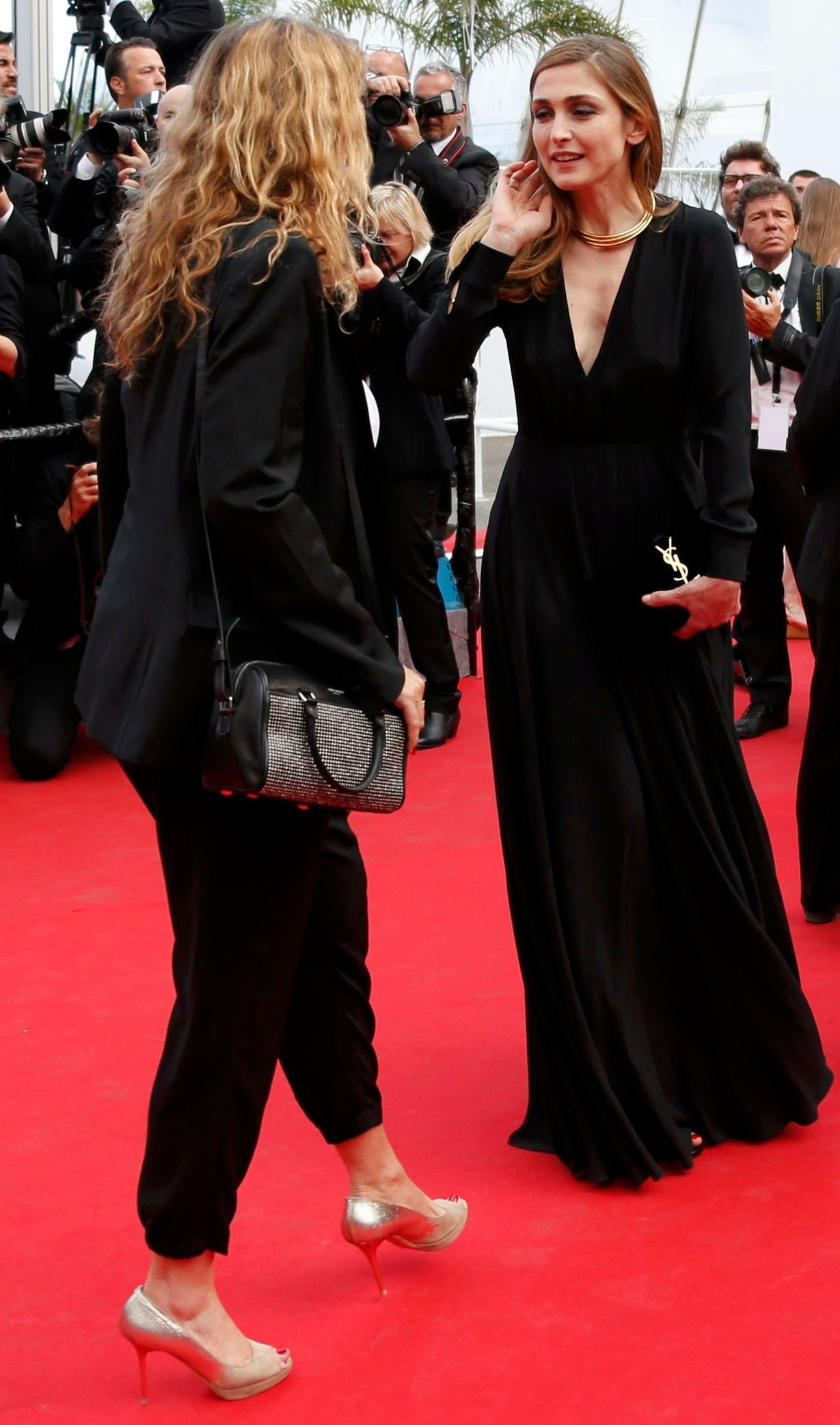 Actress Julie Gayet and director Lisa Azuelos pose on the red carpet at the 67th Cannes Film Festival in Cannes