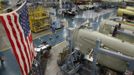 Cessna employees work on the business jets during a tour of the Cessna business jet assembly line at their manufacturing plant in Wichita, Kansas August 14, 2012. One of Cessna Aircraft Company CEO and president Scott Ernes' first moves after joining in May 2011 was to carve Cessna up into five units, each of which run by an executive who was responsible for whether the unit reported a profit or loss. Picture taken August 14, 2012. REUTERS/Jeff Tuttle (UNITED STATES - Tags: TRANSPORT BUSINESS) Published: Srp. 22, 2012, 11:41 dop.