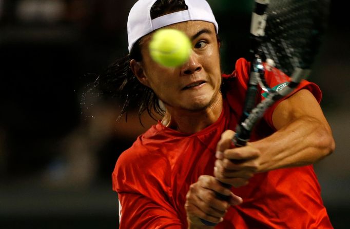 Japan's Daniel returns a shot against Czech Republic's Rosol during Davis Cup quarter-final tennis match in Tokyo