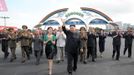 North Korean leader Kim Jong-Un (centre R) and his wife Ri Sol-Ju (centre L) attend the opening ceremony of the Rungna People's Pleasure Ground on Rungna Islet along the Taedong River in Pyongyang in this July 25, 2012 photograph released by the North's KCNA to Reuters on July 26, 2012.The Rungna People's Pleasure Ground has attractions such as a dolphinarium, a wading pool, a fun fair and a mini golf course, according to KCNA. REUTERS/KCNA (NORTH KOREA - Tags: POLITICS SOCIETY) FOR EDITORIAL USE ONLY. NOT FOR SALE FOR MARKETING OR ADVERTISING CAMPAIGNS. THIS IMAGE HAS BEEN SUPPLIED BY A THIRD PARTY. IT IS DISTRIBUTED, EXACTLY AS RECEIVED BY REUTERS, AS A SERVICE TO CLIENTS. NO THIRD PARTY SALES. NOT FOR USE BY REUTERS THIRD PARTY DISTRIBUTORS Published: Čec. 26, 2012, 3:22 dop.