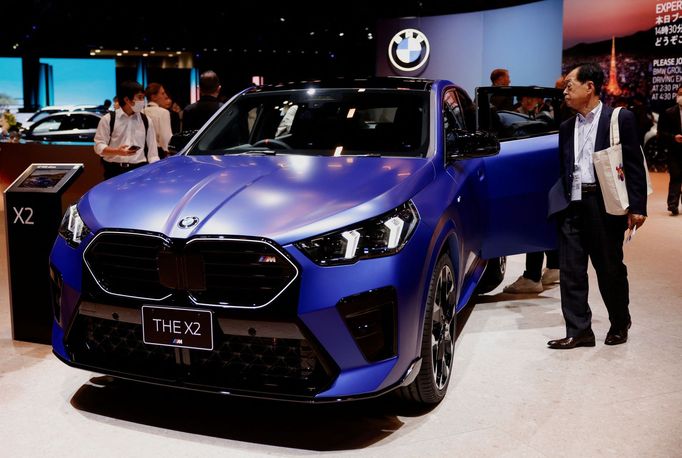 People look at the BMW X2 at the BMW booth during the Japan Mobility Show 2023 at Tokyo Big Sight in Tokyo, Japan October 25, 2023.  REUTERS/Issei Kato