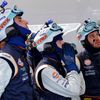 Crew members of the Aston Martin Vantage GTE Number 99 react