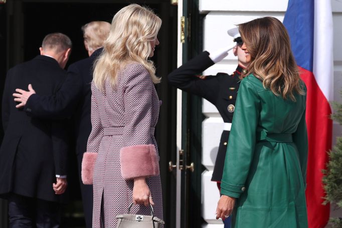 Monika Babisova, wife of the Czech Republic's Prime Minister Andrej Babis, talks with first lady Melania Trump as she arrives with her husband for a visit with U.S. Presi