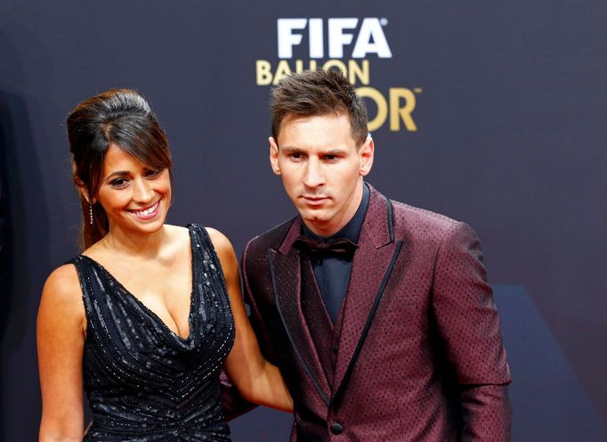 Barcelona's Lionel Messi of Argentina, a nominee for the 2014 FIFA World Player of the Year, arrives with partner Antonella Roccuzzo for the FIFA Ballon d'Or 2014 soccer