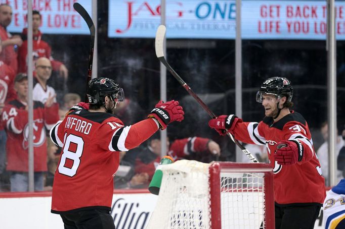 Mar 30, 2019; Newark, NJ, USA; New Jersey Devils right wing Drew Stafford (18) celebrates his goal against the St. Louis Blues with center Pavel Zacha (37)  during the se