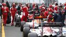 F1 cars sit in in pit lane after a crash between McLaren F1 driver Fernando Alonso and Haas F1 driver Esteban Gutierrez, which temporarily stopped the race, during the Au