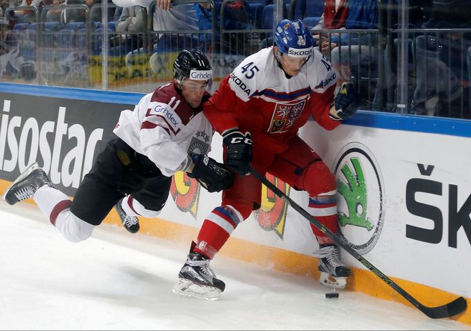 Latvia’s Kristaps Sotnieks in action with Czech Republic's Radim Simek.