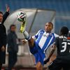 Porto's Yacine Brahimi tries to control the ball next to Academica's Richard Ofori (R) during their Portuguese Premier League soccer match in Coimbra