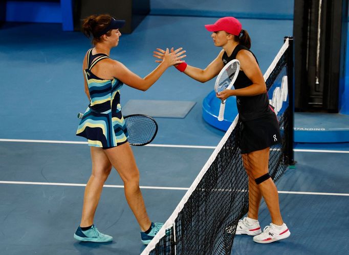 Tennis - Australian Open - Melbourne Park, Melbourne, Australia - January 20, 2024 Czech Republic's Linda Noskova shakes hands with Poland's Iga Swiatek after winning the