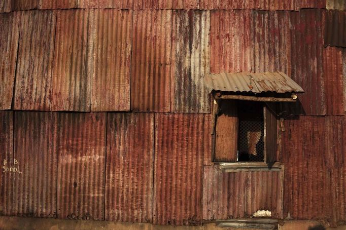 Rusted metal sheets cover side of traditional colonial-era Board House in Congo Town of Sierra Leone's capital Freetown