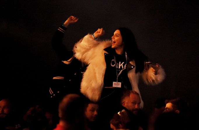 Models Cara Delevingne and Kendall Jenner dance as Kanye West performs on the Pyramid stage at Worthy Farm in Somerset during the Glastonbury Festival