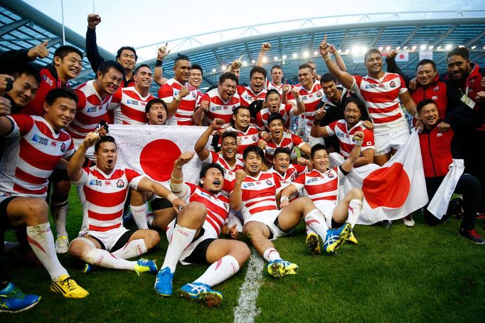 Japan celebrate victory after the match Reuters / Eddie Keogh Livepic